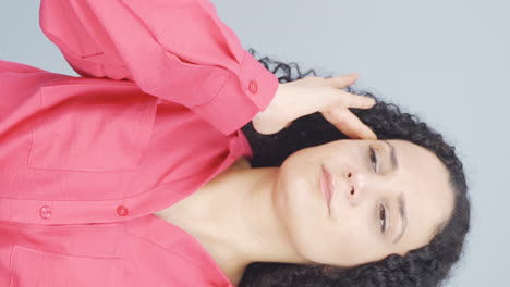 Vertical-video-of-Young-woman-with-migraine-is-experiencing-pain.
